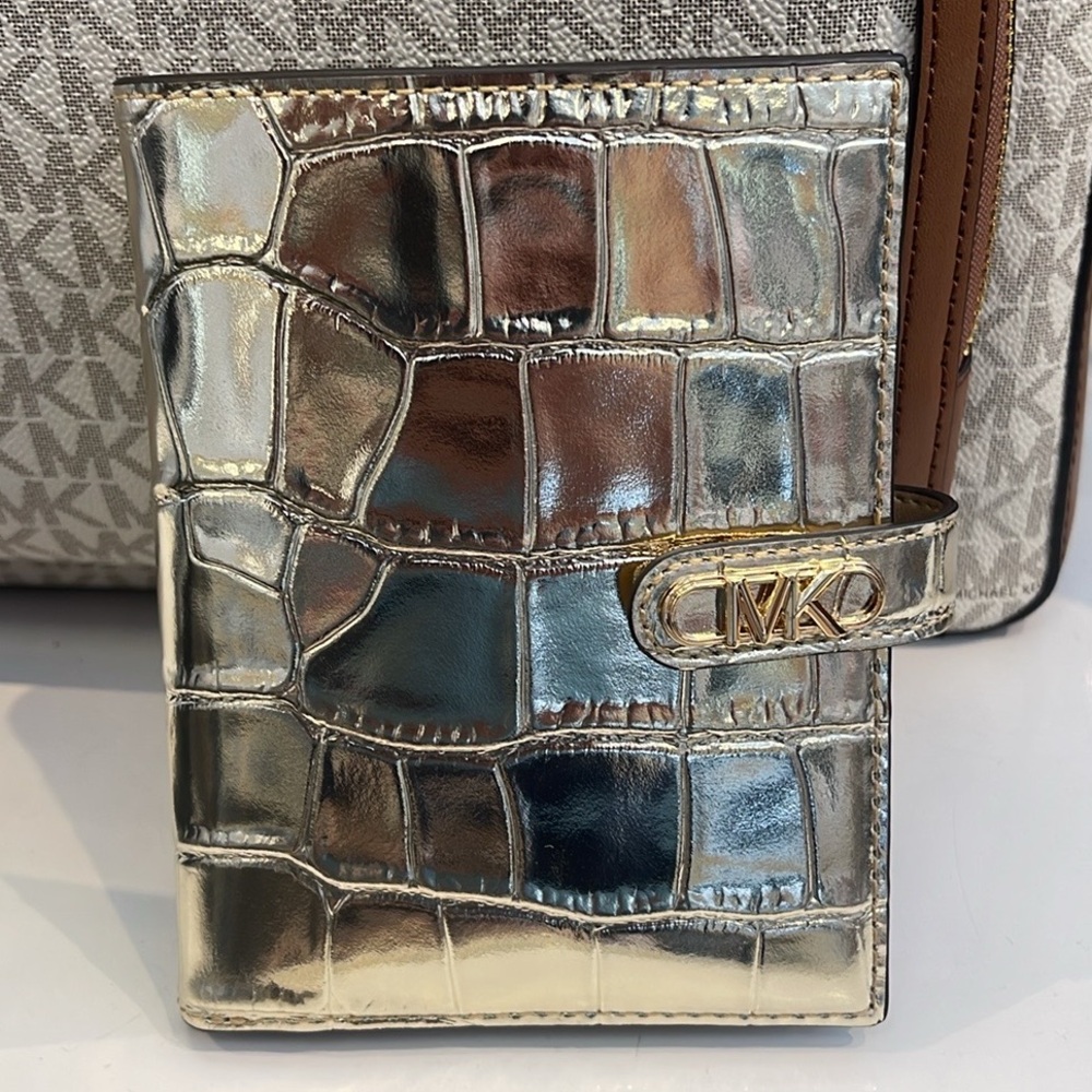 Michael Kors Empire Metallic Crocodile Embossed Leather Passport Wallet
Pale Gld